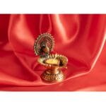 Ghee lamp Pauw Messing